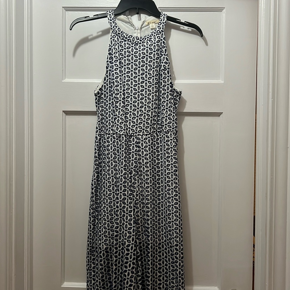 Miami from Francesca’s white and navy eyelet flowered jumpsuit. Size small.